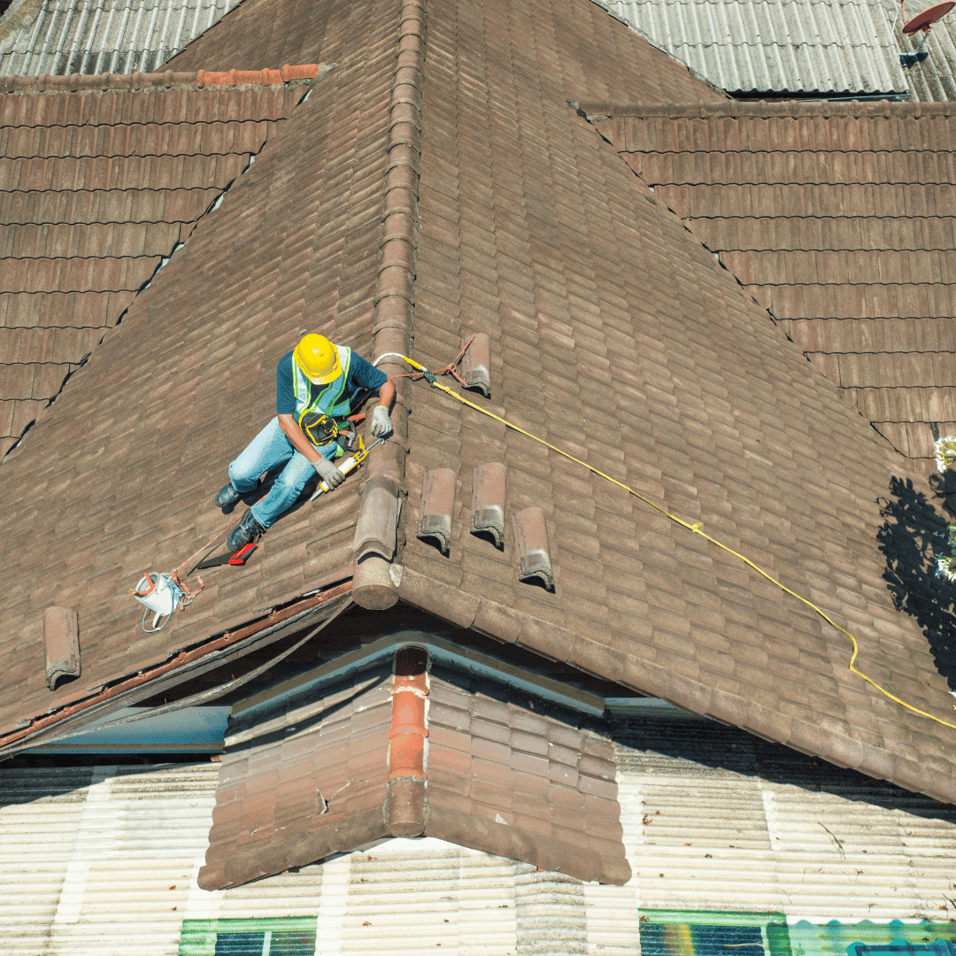 Aerial view of roofer repairing a roof