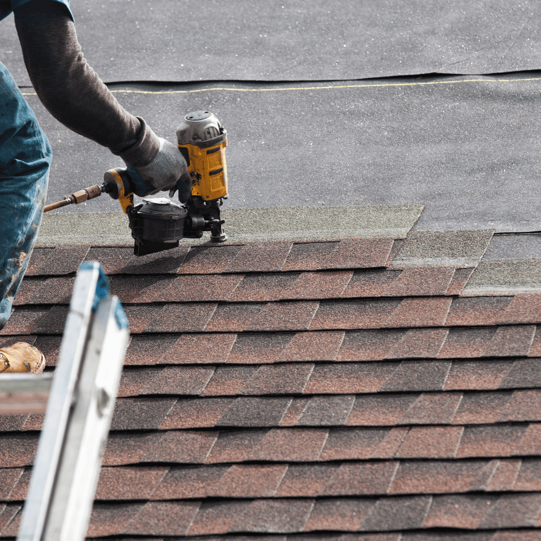 Roofer installing tiles